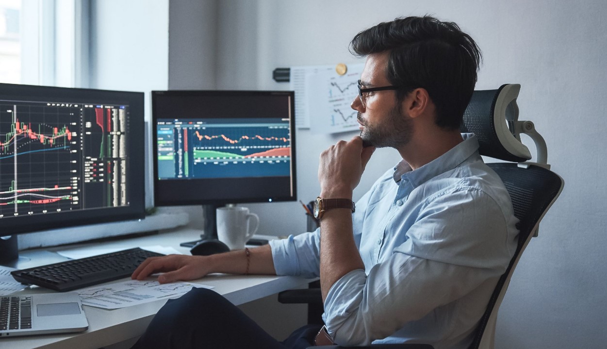 Trader doing day trading in his office